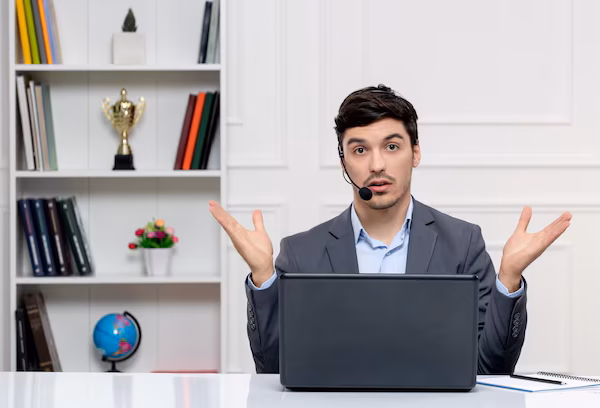 customer-service-handsome-man-grey-suit-with-computer-headset-confused-waving-hands_140725-164785